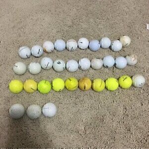 Set of 33 golf balls mixed brands (labeled as bag)